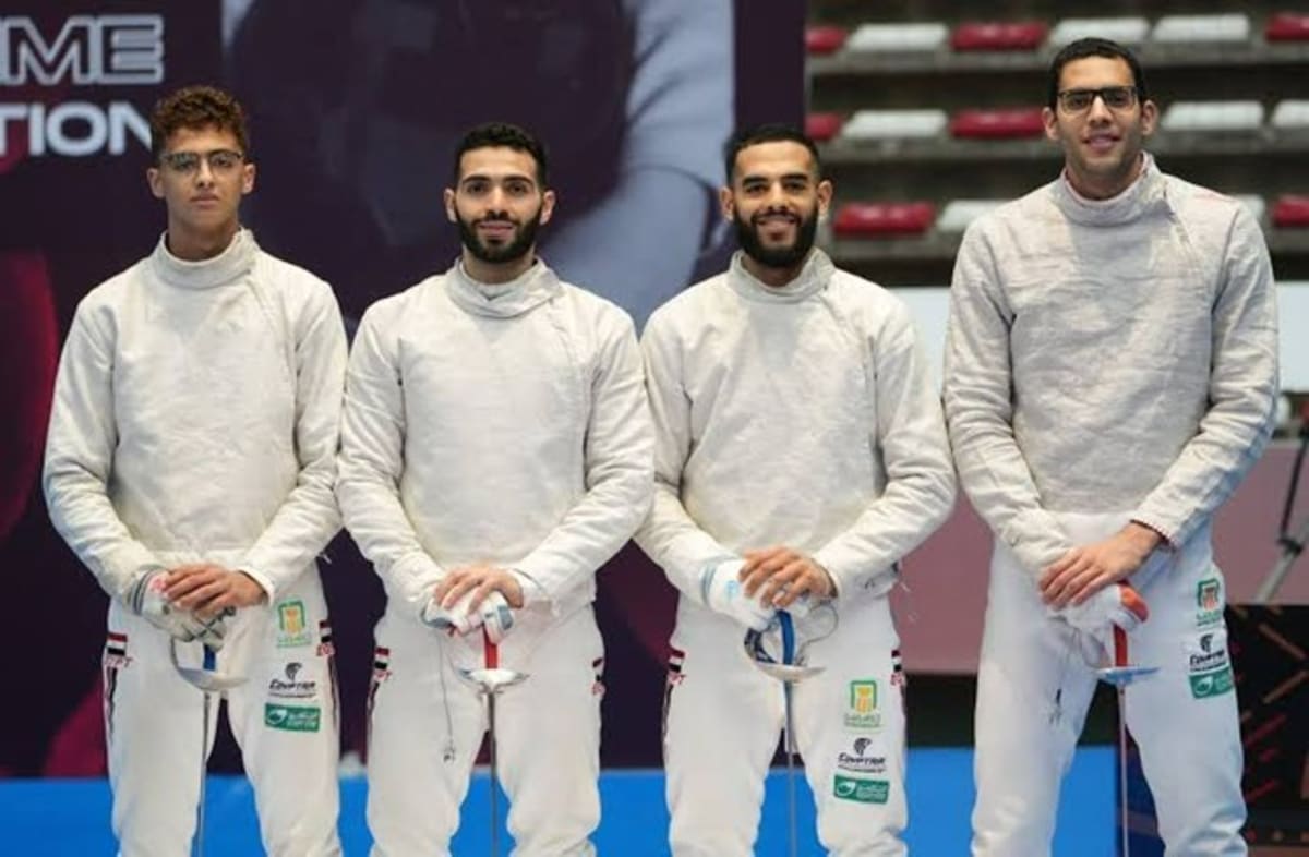 Egyptian sabre fencing team celebrating bronze medal victory at World Championships in Hong Kong