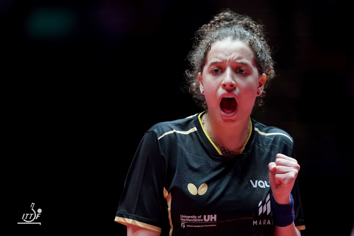 Hana Goda playing table tennis in competitive match wearing Egyptian team uniform