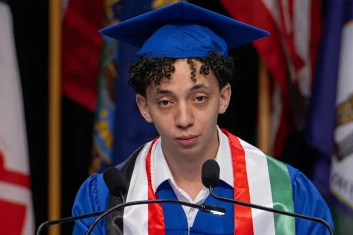 Young Egyptian graduate Mostafa Mubarak in cap and gown celebrating three engineering degrees