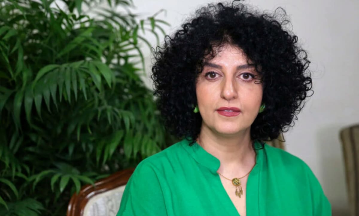 Iranian activist Narges Mohammadi sitting in Tehran apartment before hospitalization for heart condition