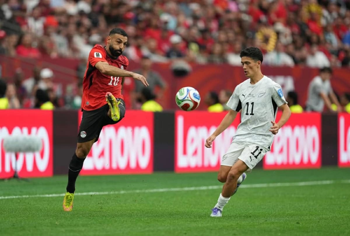 Mohamed Salah celebrating in Egyptian national team jersey after scoring historic World Cup goal