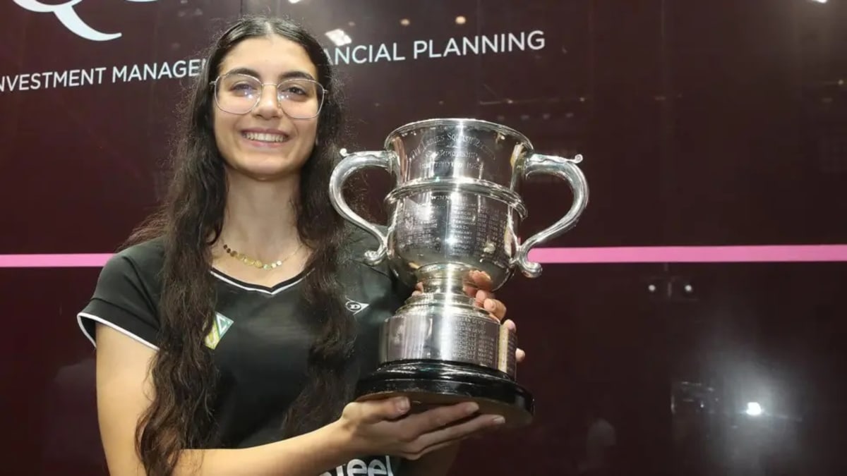 Egyptian squash player Amina Orfi celebrates her historic British Open championship victory at age 18