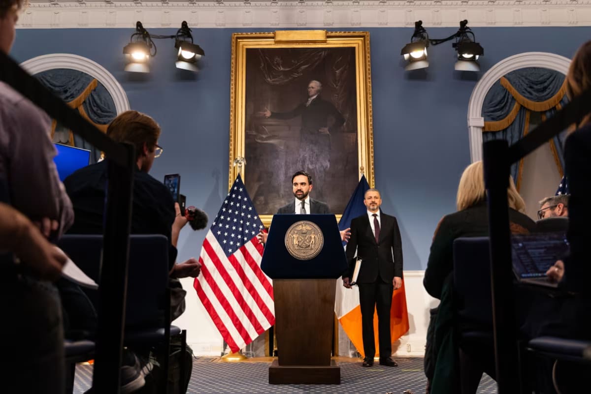 New York City Mayor Zohran Mamdani speaking at podium about affordable housing plan