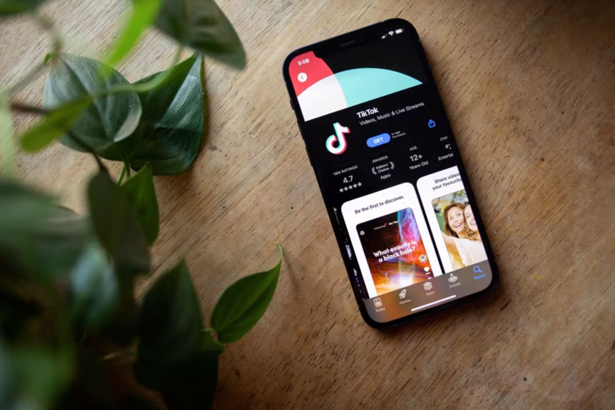 TikTok app icon displayed on smartphone screen representing enhanced child privacy protections