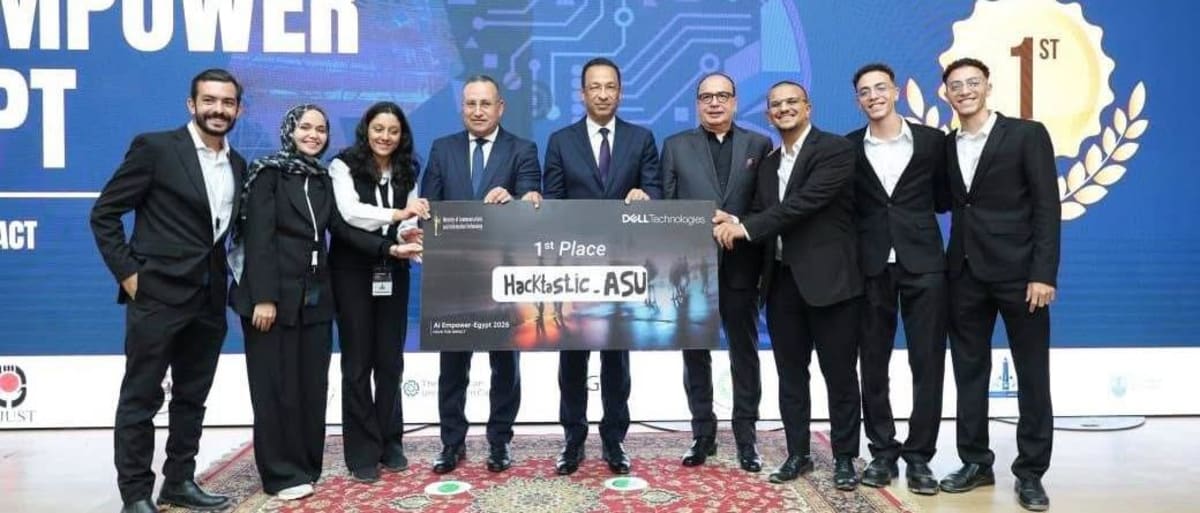 Egyptian university students collaborating on artificial intelligence project with laptops and technology equipment