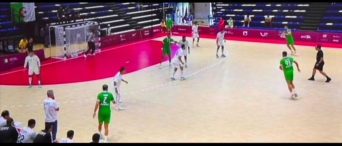 Egyptian handball team players celebrating their semifinal victory over Algeria at Mediterranean Games