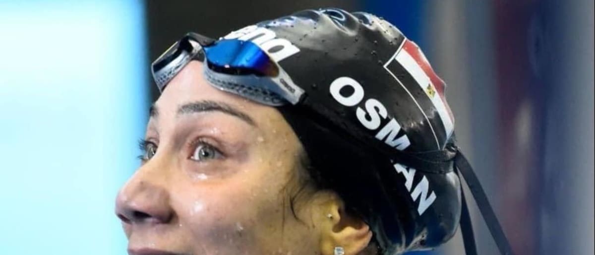 Egyptian swimmer Farida Osman competing in butterfly stroke at Mediterranean Games pool