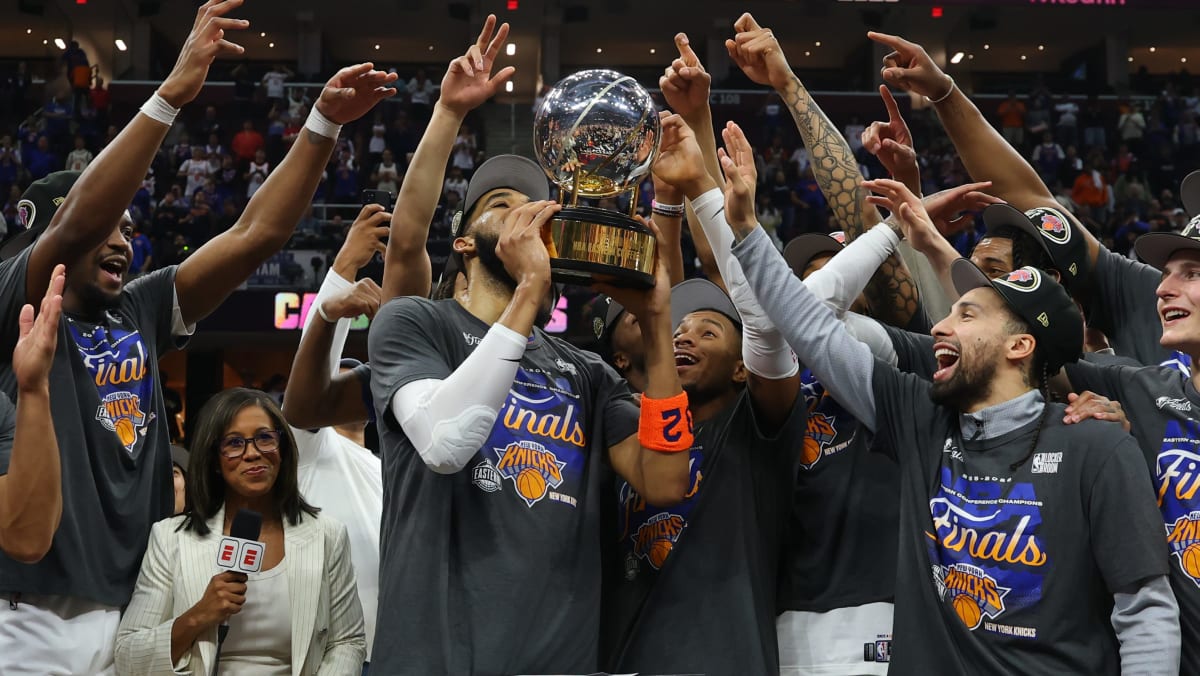 New York Knicks players celebrating on court after sweeping into NBA Finals