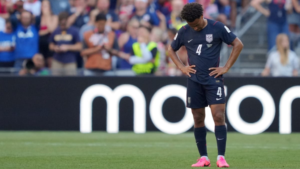 Tyler Adams in Team USA uniform applauding fans after World Cup match in Seattle