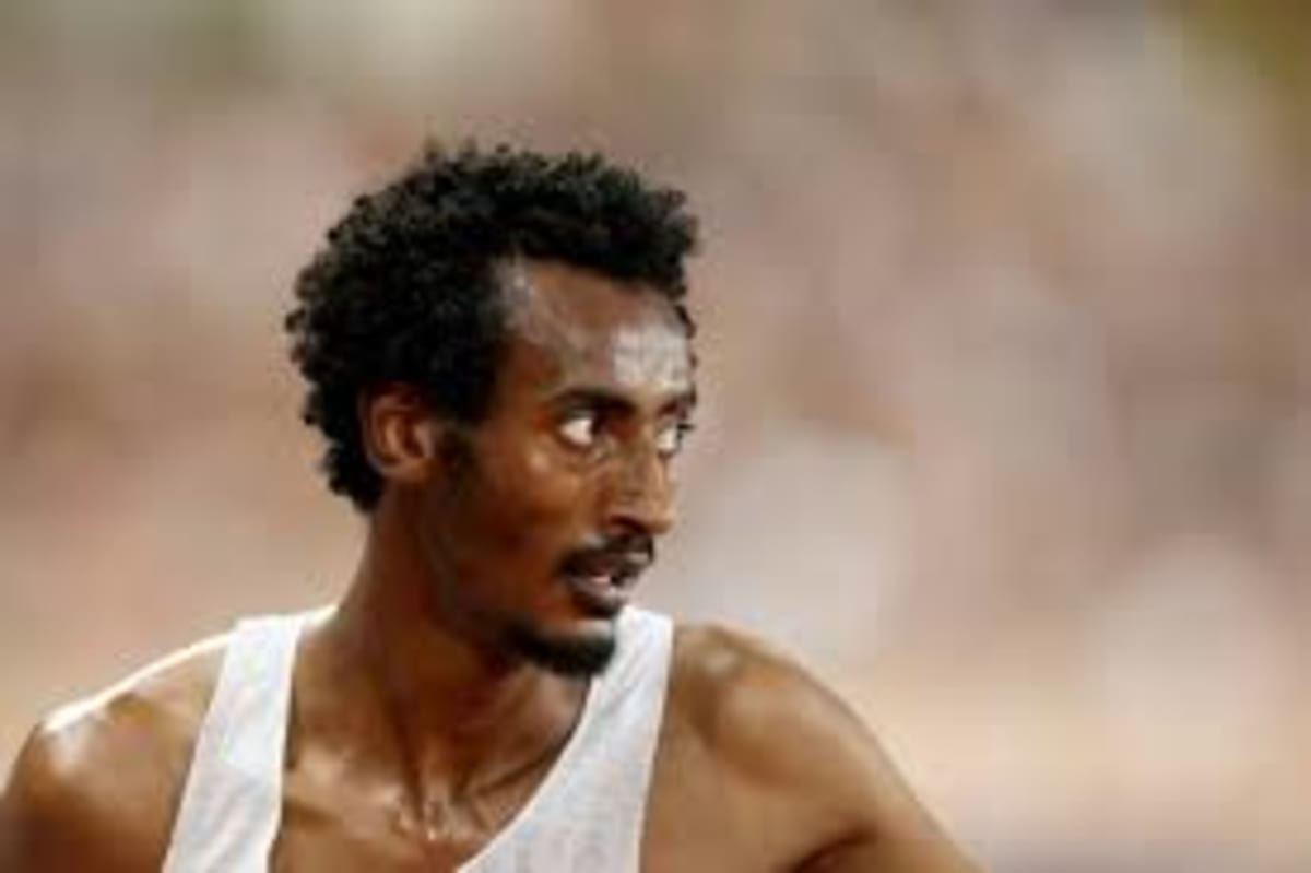 Ethiopian distance runner Yomif Kejelcha celebrating after breaking half-marathon world record in Buenos Aires