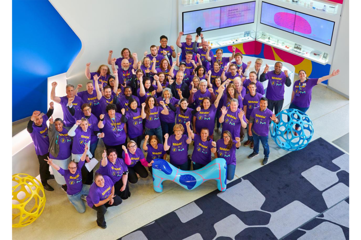 Scientists and students conducting hands-on science experiments together in classroom setting