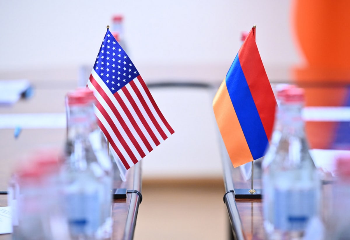 US and Armenian officials shake hands at signing ceremony for TRIPP infrastructure peace agreement