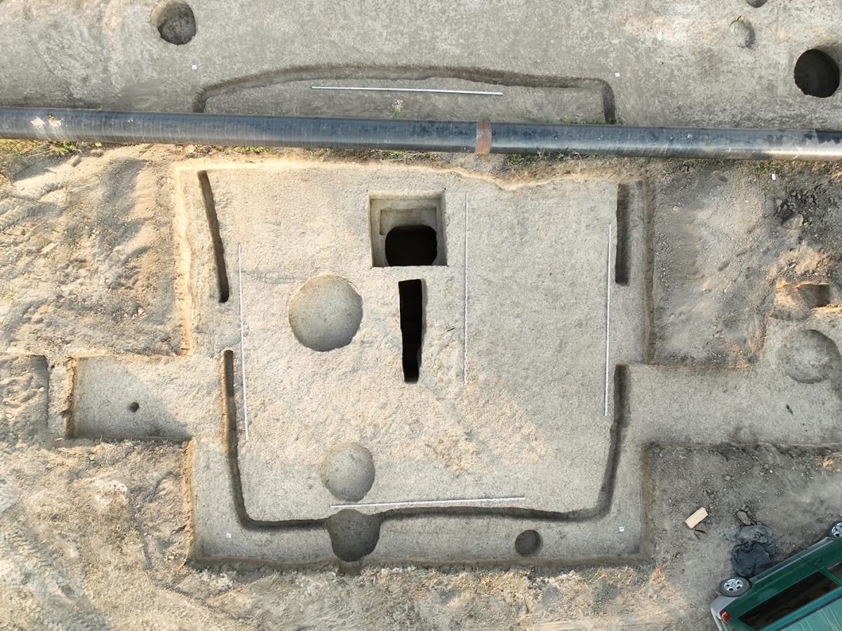 Ancient burial mound excavation site showing layers of medieval settlement in Mayrtup, Chechnya