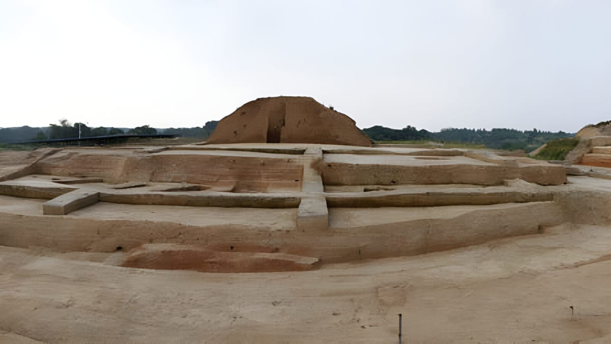 Ancient Chinese burial chamber filled with bronze coins and gold artifacts from Han Dynasty tomb