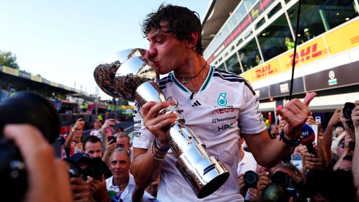 Kimi Antonelli celebrates on podium after winning Italian Grand Prix at Monza circuit