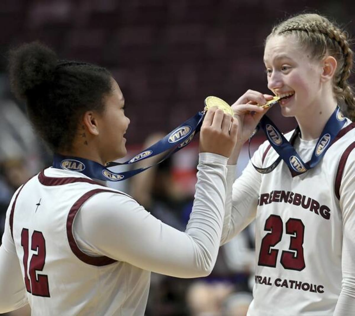 Greensburg Central Catholic girls basketball team celebrates with state championship trophy and gold medals