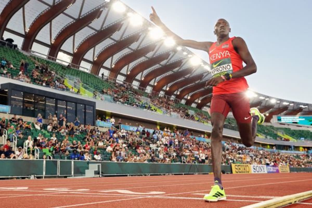 Young runner Emmanuel Kiprono celebrating victory in 3000 meter race at Oregon track