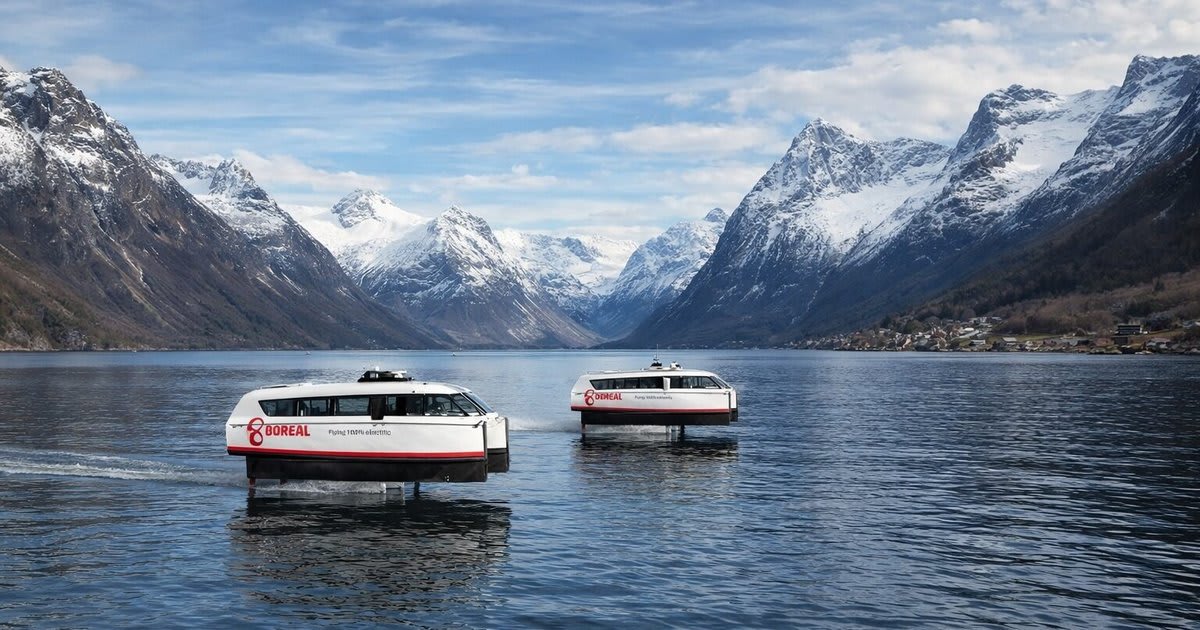 Sleek electric hydrofoil ferry gliding above water on Norway's scenic coastal fjords