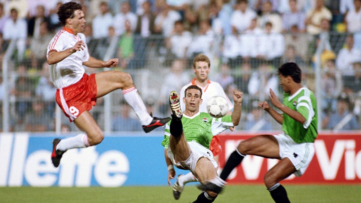 ** Mohamed Salah celebrating in Egyptian national team jersey with arms raised in triumph