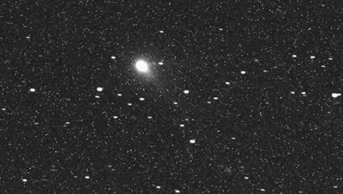European JUICE spacecraft's view of interstellar comet 3I/ATLAS against dark space background
