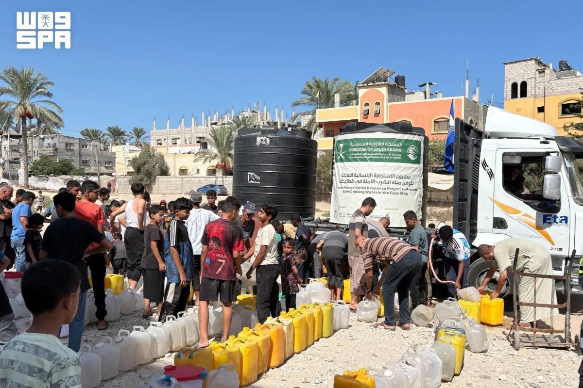 Humanitarian aid workers distribute food baskets to families in need during relief operations