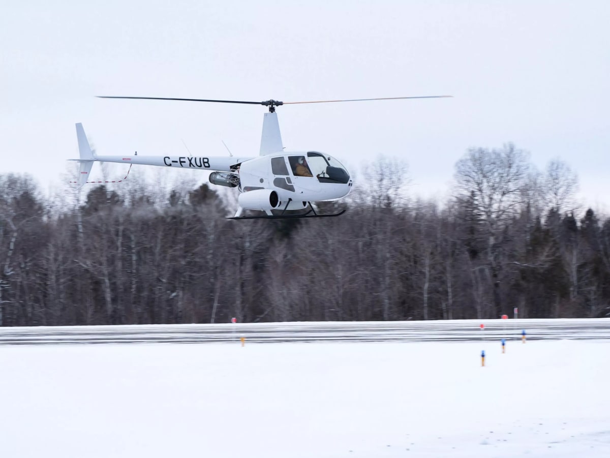 Hydrogen-powered Robinson R44 helicopter on ground at Quebec airport after completing historic first operational flight