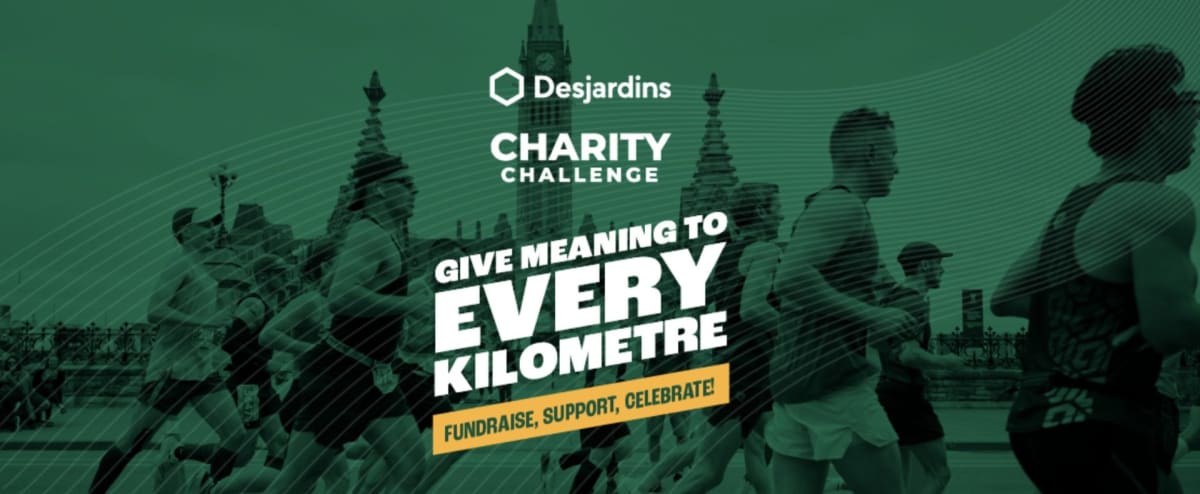 Diverse group of runners in colorful charity team shirts crossing finish line together smiling