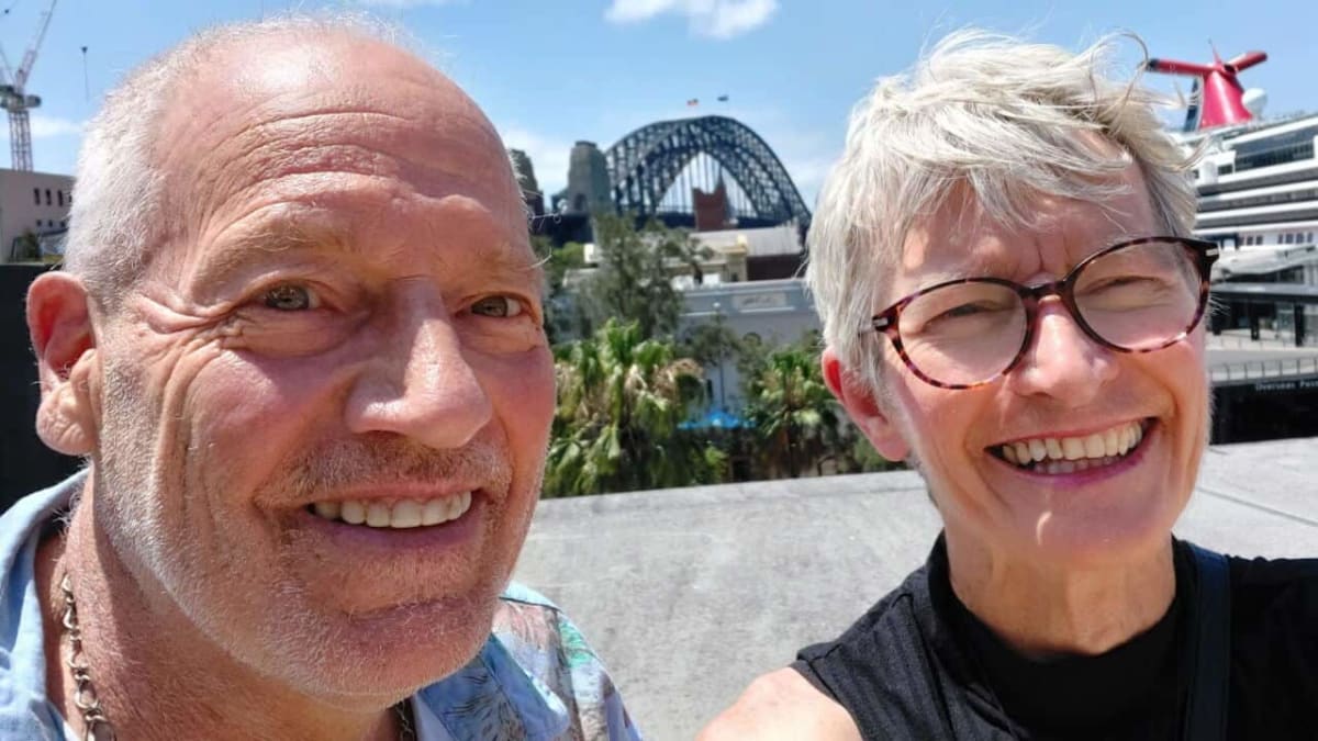 Elderly couple smiling together while maintaining their own separate homes in Australia
