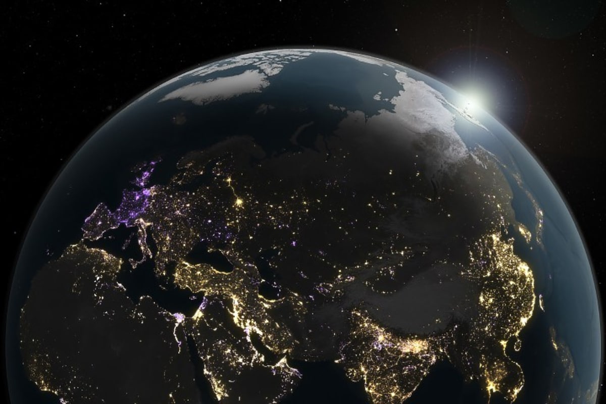 Global map showing Earth's nighttime light changes with gold brightening and purple dimming areas
