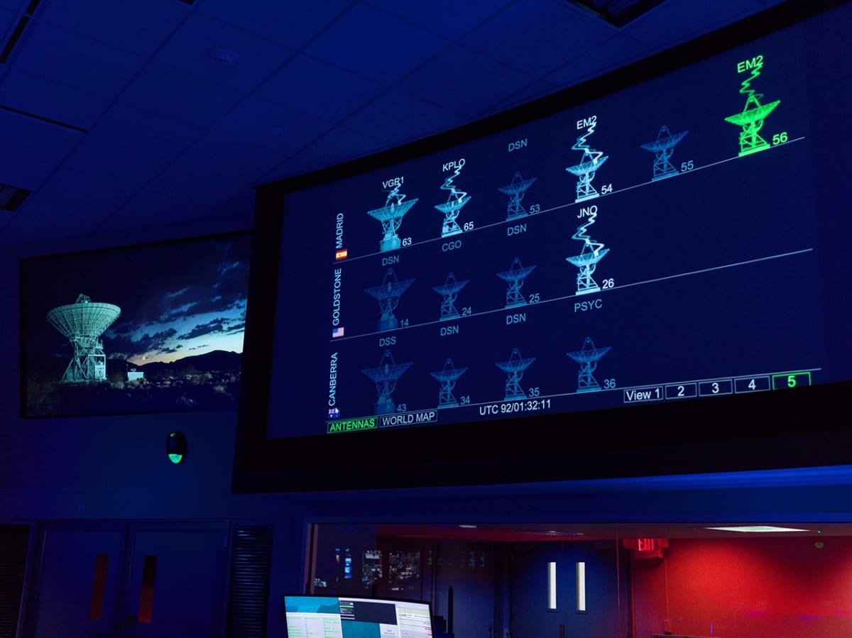 Computer screens showing Deep Space Network antennas tracking Artemis II lunar mission signals