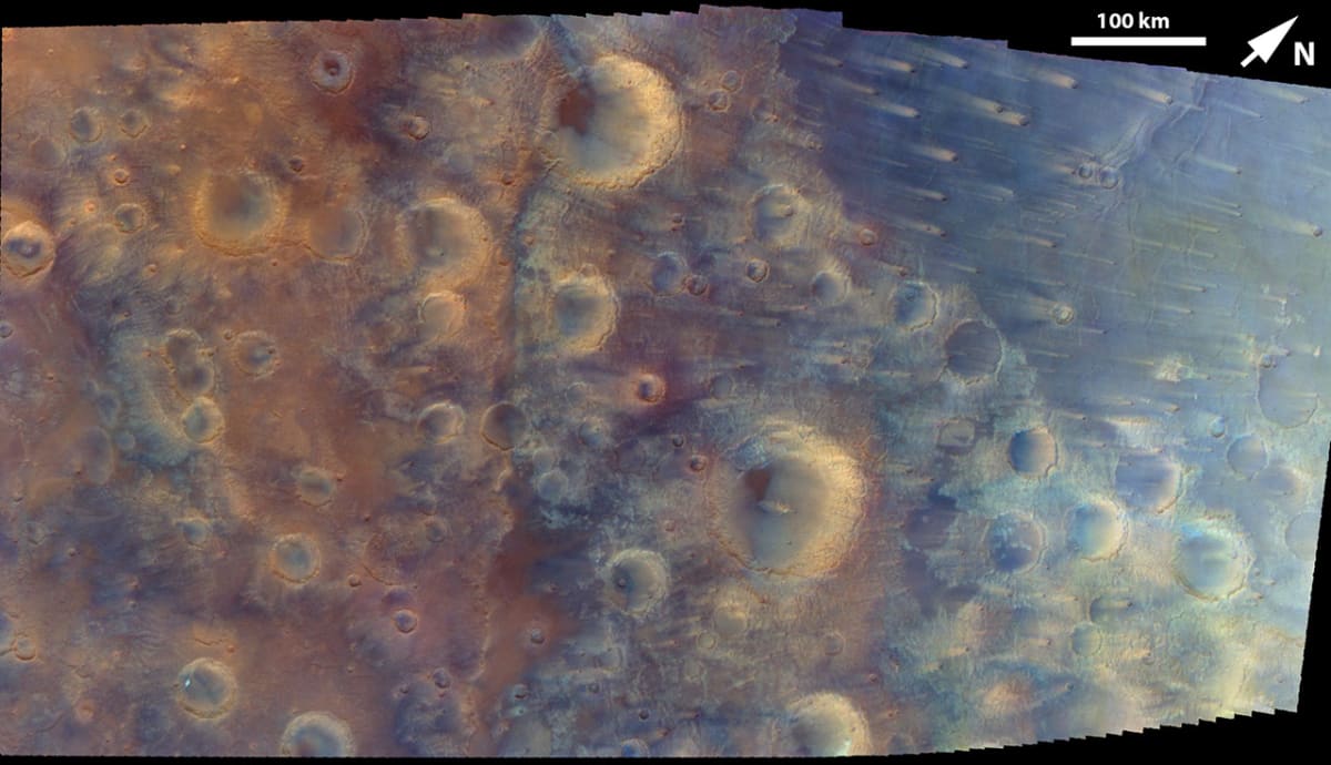 Enhanced color mosaic of Mars surface showing Fournier Crater and ancient volcanic plains captured by NASA Psyche