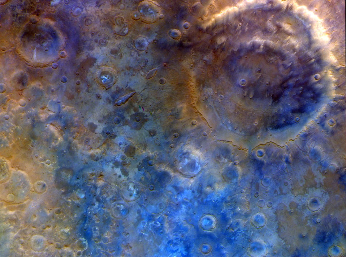 Enhanced-color view of Mars' massive Huygens Crater showing ancient cratered highlands in blue and orange tones