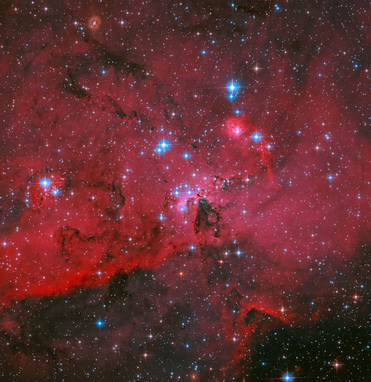 Hubble Reveals 2,500 Baby Stars Being Born in Crimson Cloud - Image 3