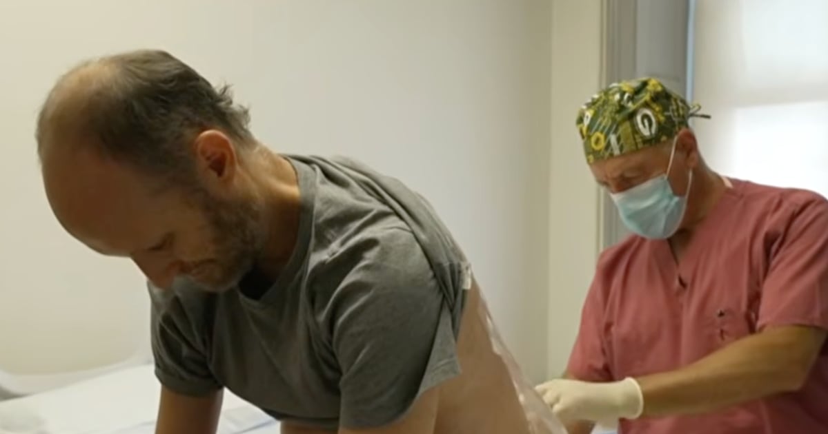 Scientist Jeff Vierstra receiving experimental spinal infusion treatment for ALS prevention at Columbia University