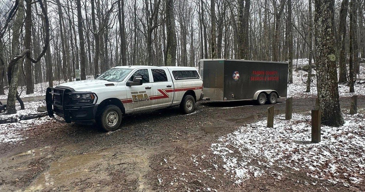 Rescue crews hiking through snowy forest terrain near Springer Mountain on Appalachian Trail