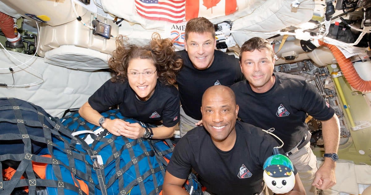 Four Artemis II astronauts floating inside Orion spacecraft cabin during historic moon mission