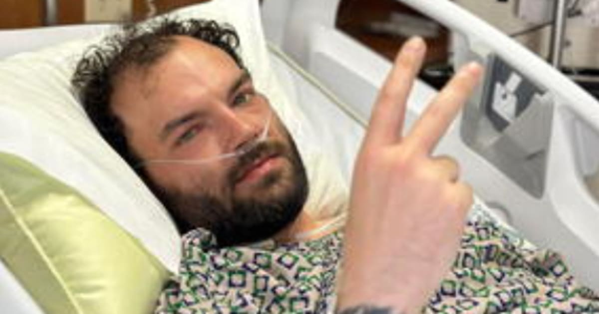 David Lyon in hockey gear on ice rink after beating Stage IV colon cancer