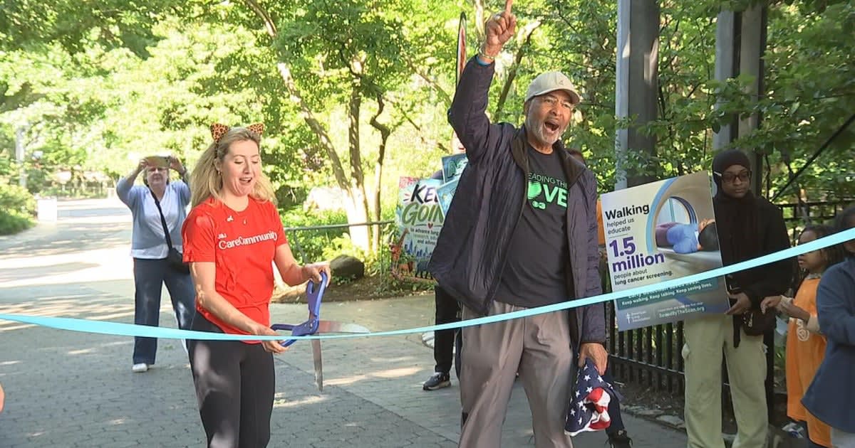 Large group of lung cancer survivors and supporters walking together through Philadelphia Zoo