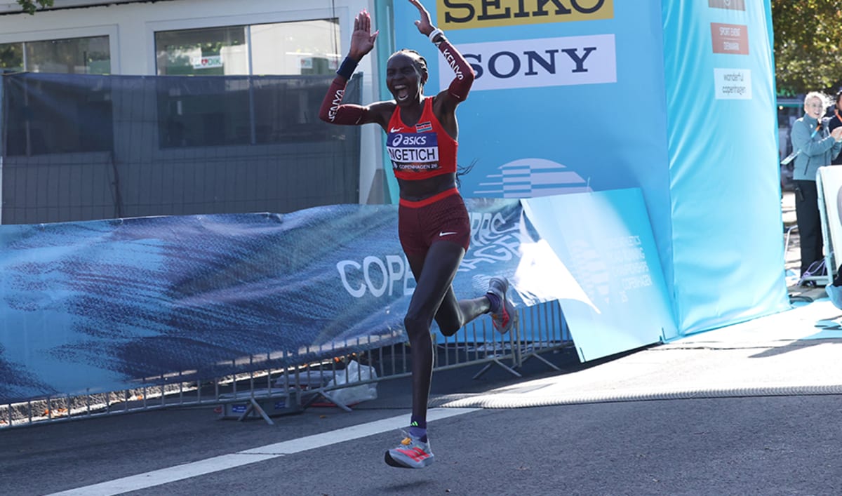 Agnes Ngetich running in racing gear crossing finish line at Copenhagen Half Marathon