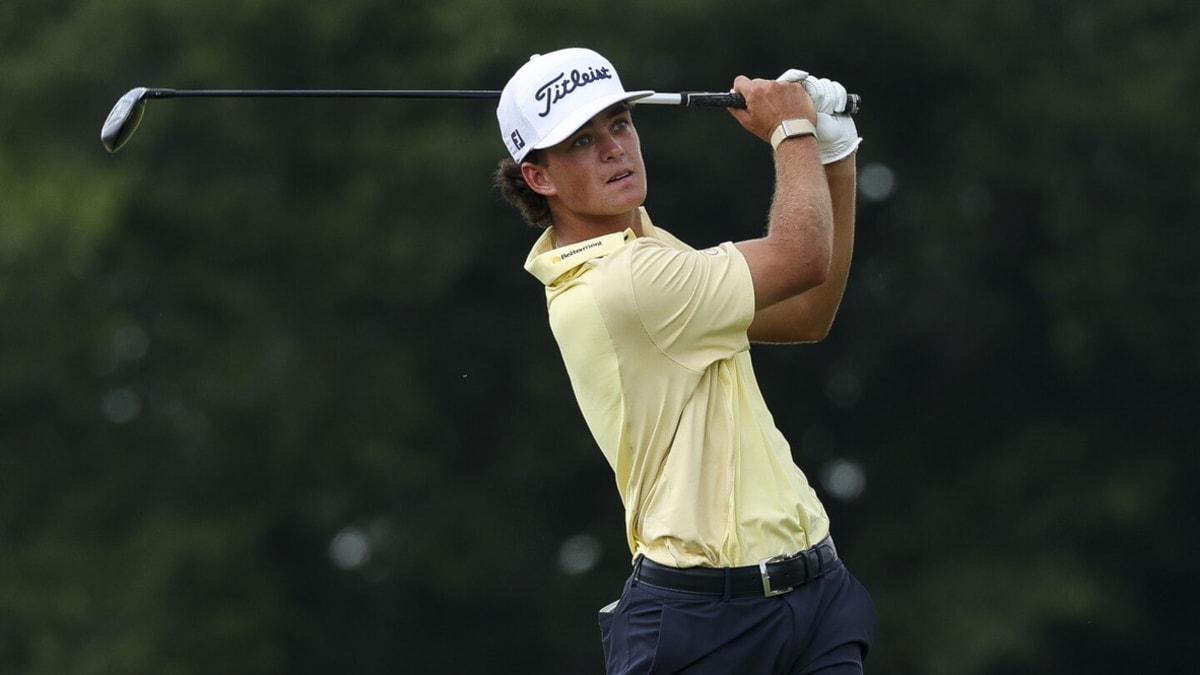 Young golfer Jackson Koivun celebrating with fist pump after winning 3M Open tournament