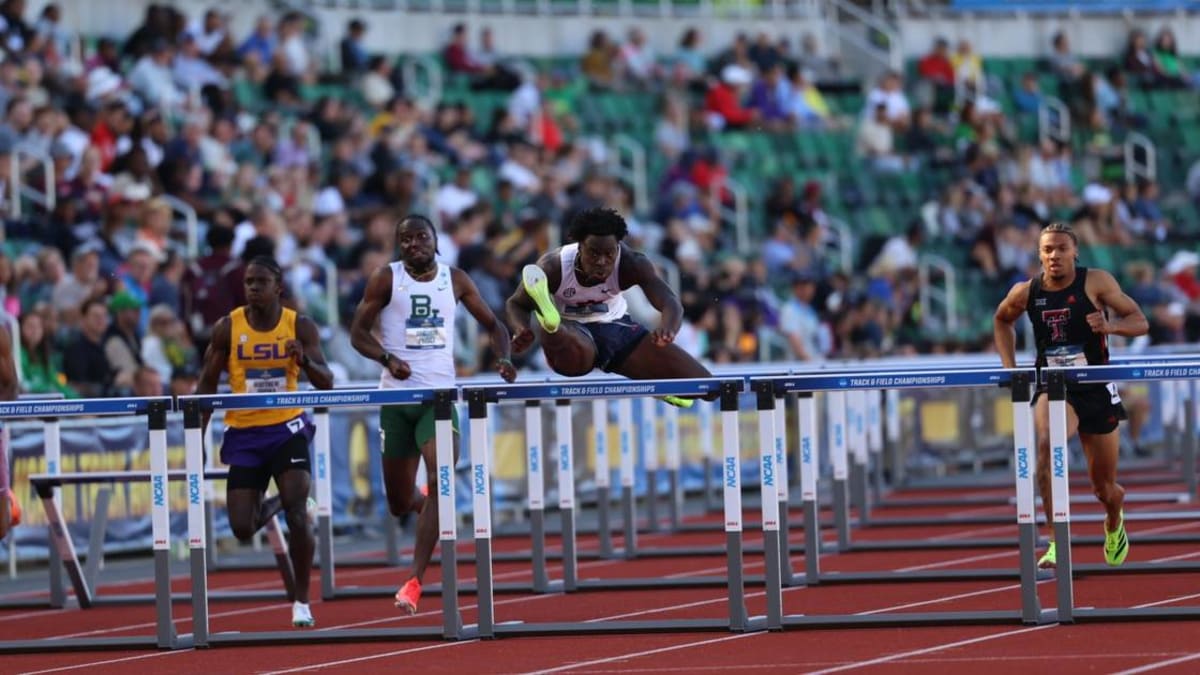 Auburn runner Ja'Kobe Tharp competing in 110-meter hurdles race at outdoor track championship