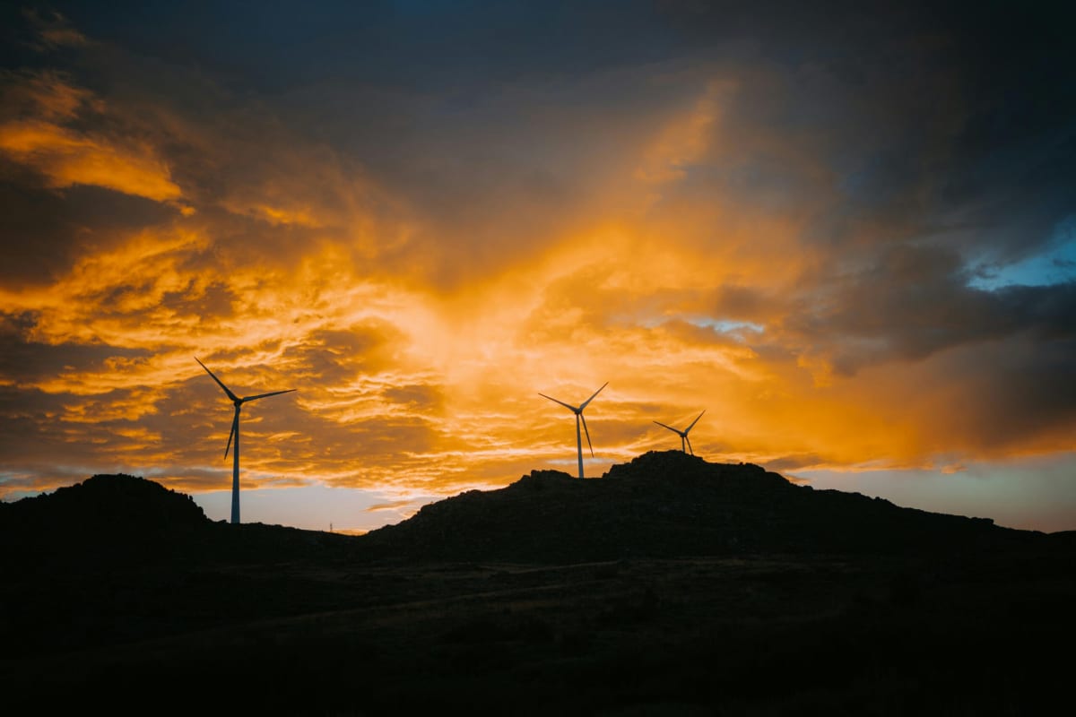 Solar panels gleaming under bright Arizona sunshine with desert landscape in background