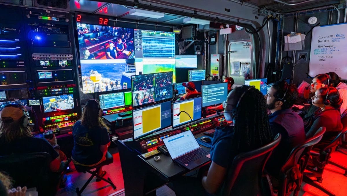 Remotely operated vehicle exploring deep ocean floor during scientific expedition near Wake Island
