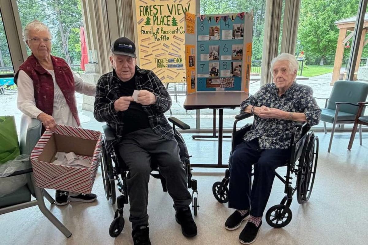 Elderly residents at Forest View Place long-term care home drawing raffle prizes for fundraiser