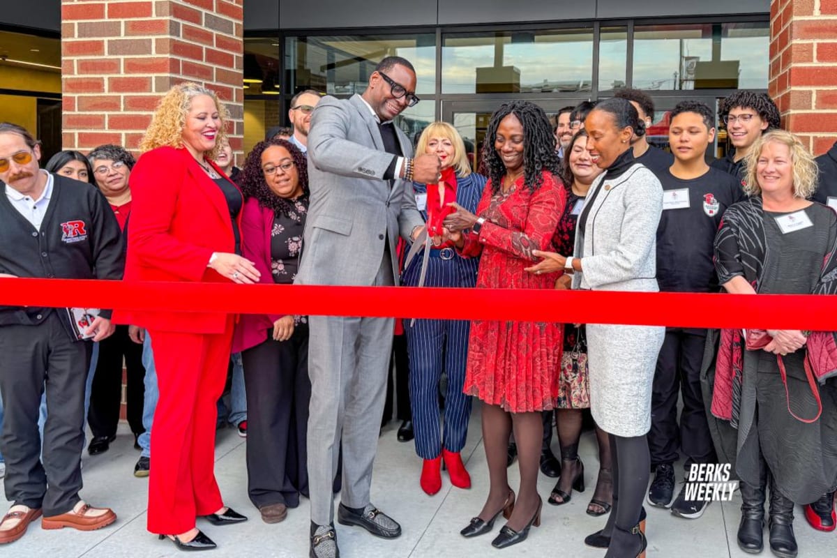 Students and district leaders gather outside the new Reading Innovation Academy building for ribbon-cutting ceremony
