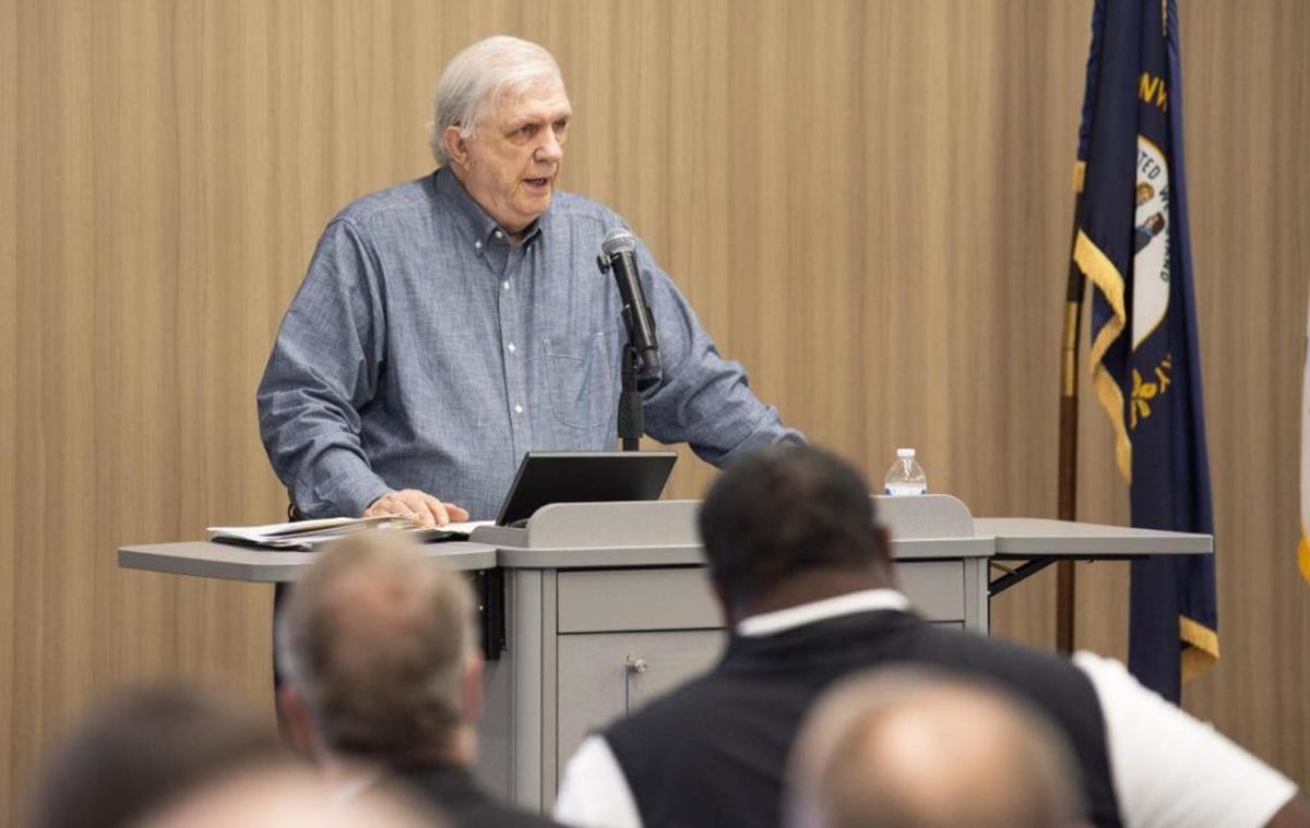 Joe Bill Campbell speaking at podium announcing charitable donations from Tincher Foundation
