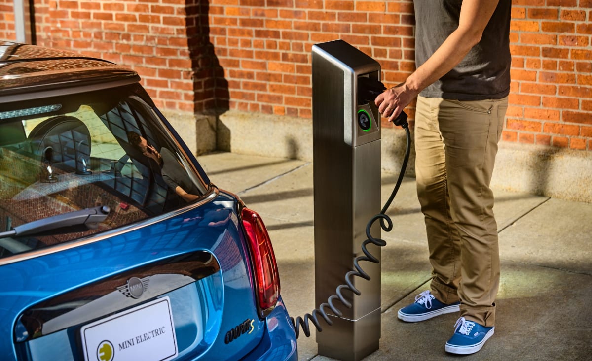 Electric vehicle charging station on Philadelphia city street curb in residential neighborhood