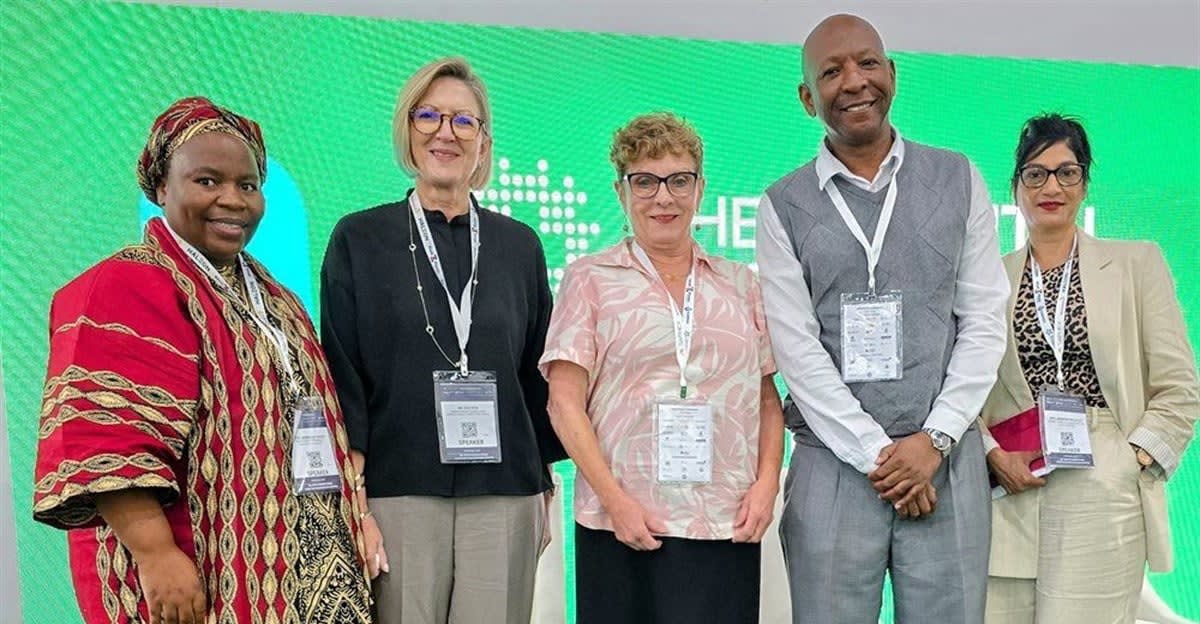 Healthcare professionals at panel discussion sharing African medical innovation success stories at conference