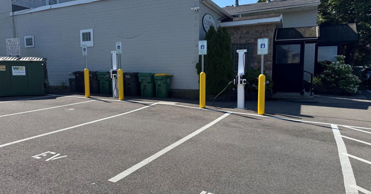 ** Two electric vehicle charging pedestals in downtown Hamburg New York parking lot