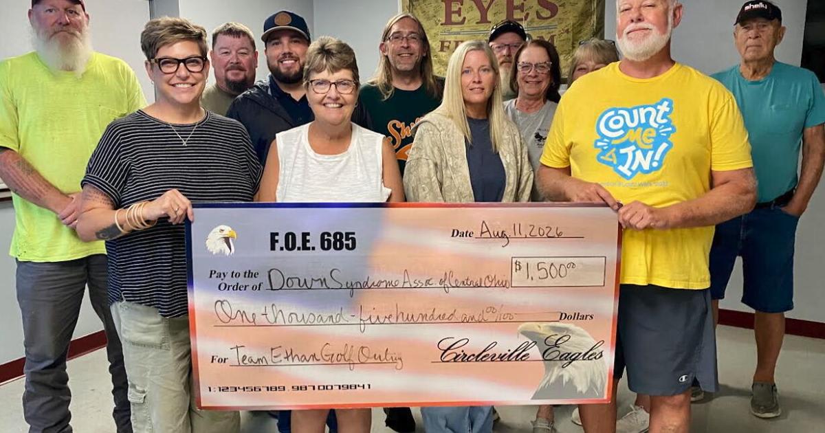 Members of Circleville Eagles Aerie presenting oversized donation check to community organization representatives